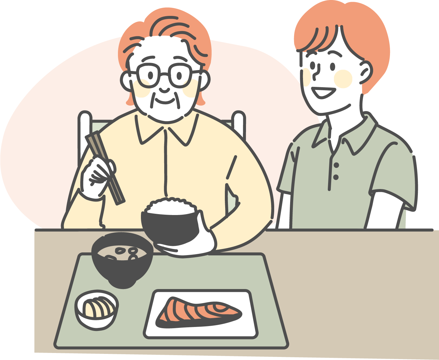 食事の介助を受ける男性